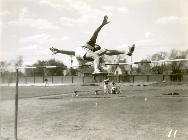 Willis Ward mid-air completing a high jump