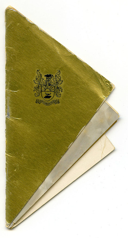 Triangular booklet with gold cover. Stamped with University shield and motto.