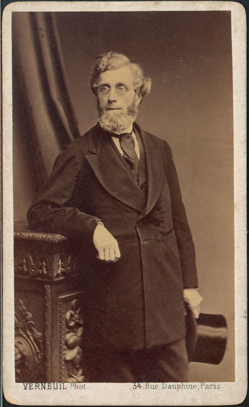 Cabinet card photograph portrait of President Pro Tempore Henry Freize. He is leaning against a table and holding a top hat. 