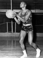 Posed action photo of M.C. Burton, UM basketball captain 1958/59