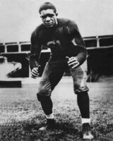 Willis Ward posed in football uniform