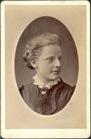 Cabinet card photograph with an oval shaped portrait of Caroline Hubbard as a young woman. 